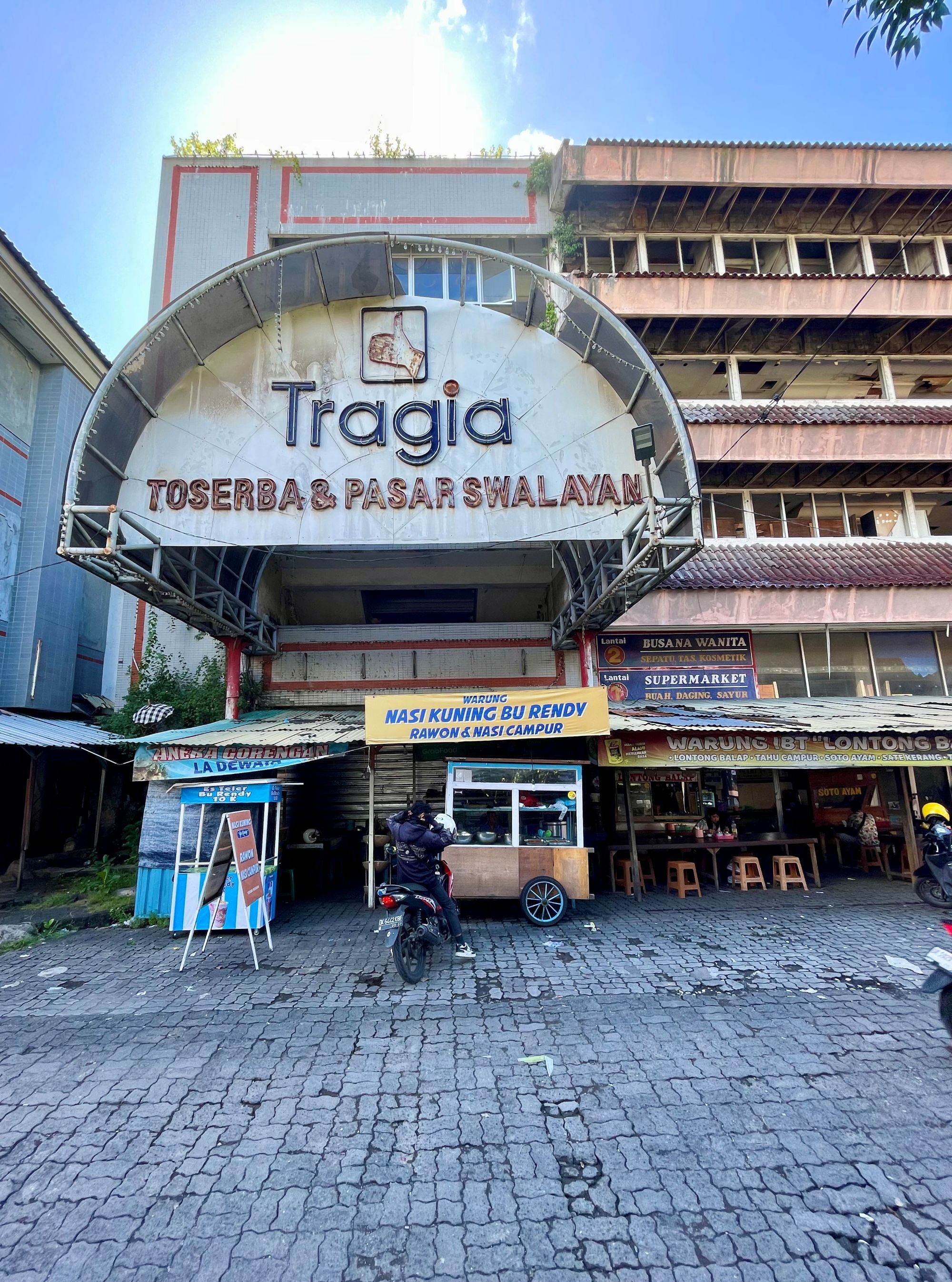 Located at a former detention site for victims of the 1965 massacres, the “Tragia” supermarket has stood empty since 2007, with some locals considering it haunted